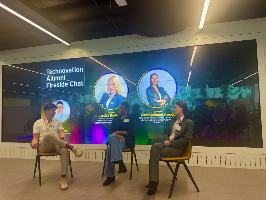 Speakers in conversation on stage during the Technovation Alumni Fireside Chat at EY Wavespace, London.